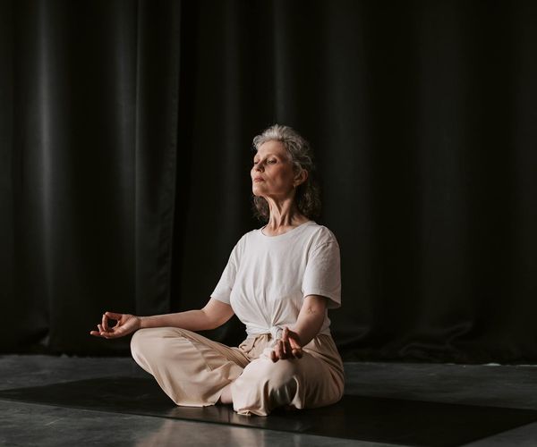 Close up of hands in a mudra position during meditation